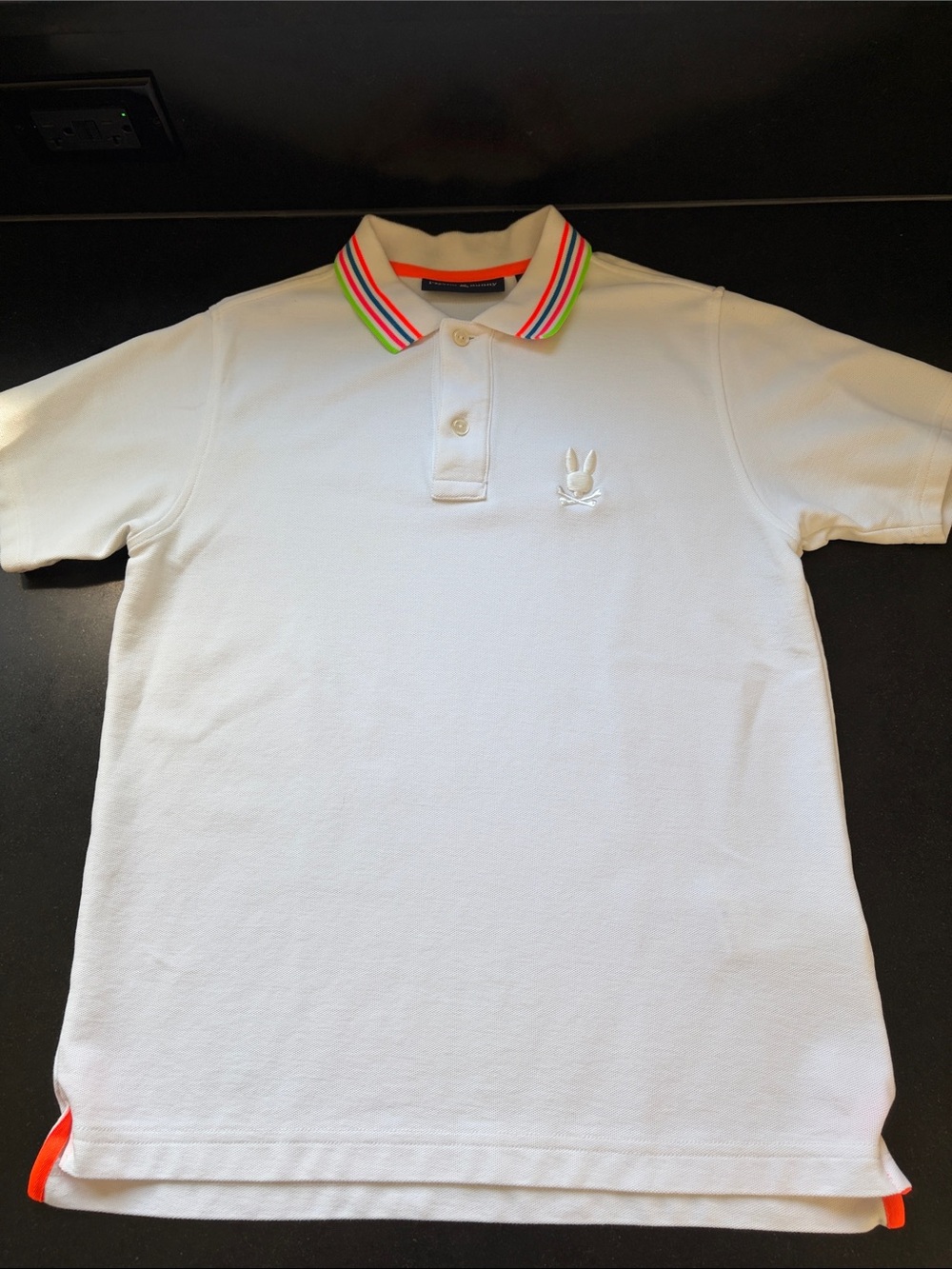 Psycho Bunny White Polo with Neon Orange and Multicolor Stripe Collar